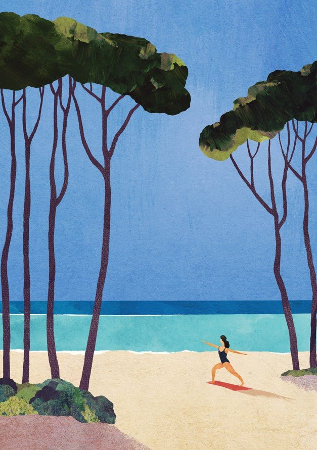 Woman practicing yoga on a beach with trees and blue sky in the background. framed